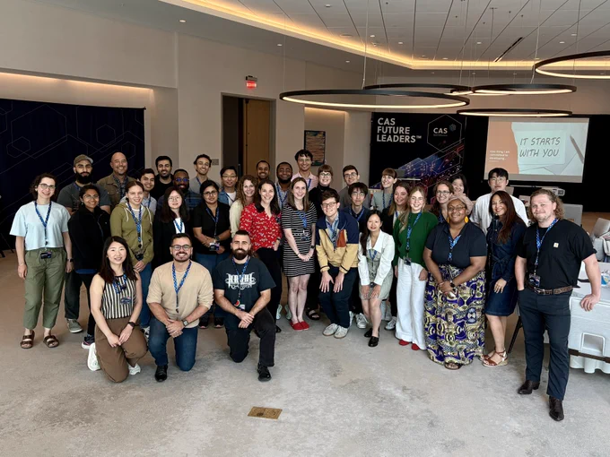 A group of early-career scientists posing with two workshop facilitators