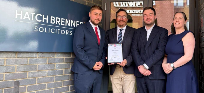 L-R Matthew Whitman, Paul Fleet (British Red Cross), Sam Main and Caroline Billings stand outside the Hatch Brenner office with their 2024 Will Aid certificate.