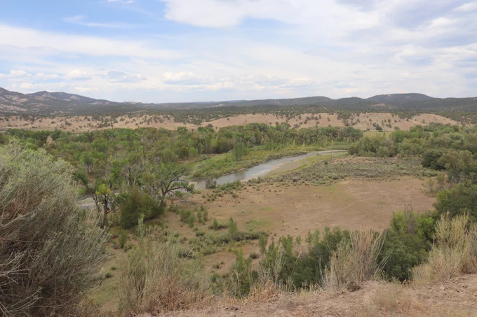 An unburnt view of the San Juan River winding through an area near the Middle Mesa Fire 