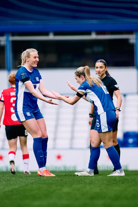 Simone Magill high fives Shannon Cooke.