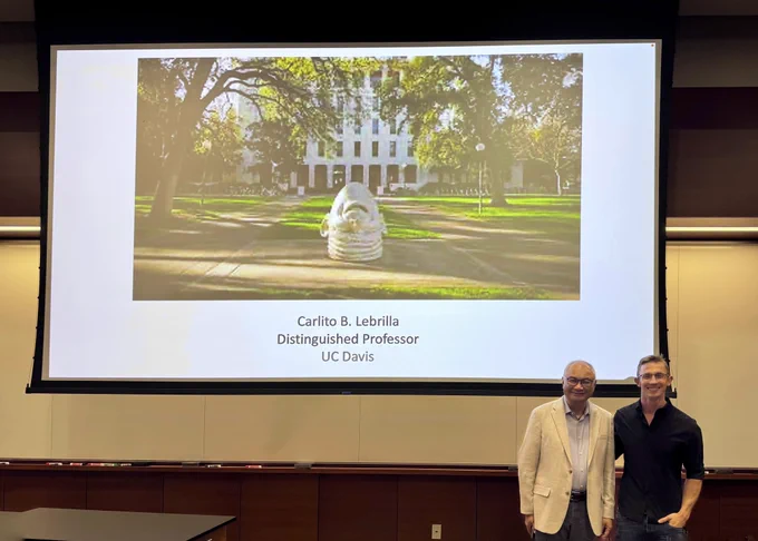 Carlito Lebrilla standing next to Charlie Fehl in Schaap Hall