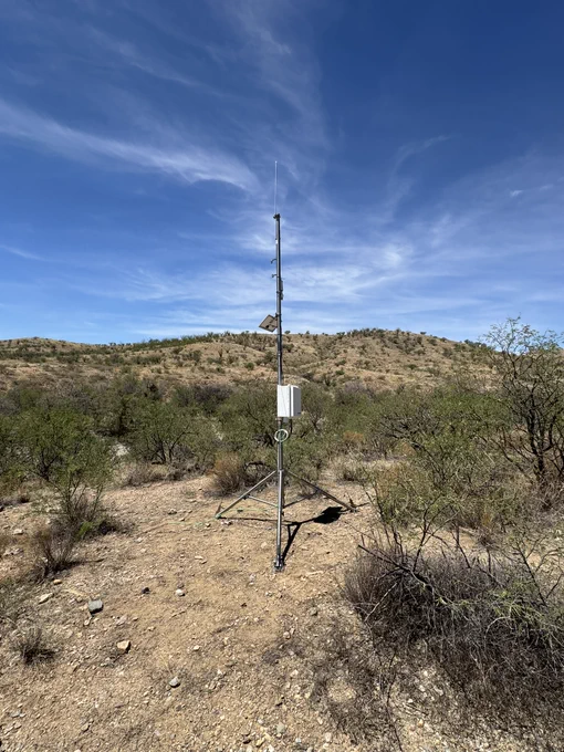The completed evapotranspiration tower, surrounded by mesquite shrubs and grassland.