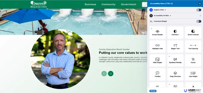 An image shows a screenshot of the lower portion of the OakGov.com website. The right shows a circular photo of Oakland County Executive Dave Coulter, while the right side shows a UserWay accessibility menu, offering options for users with visual, cognitive and motor disabilities, e.g. dyslexia-friendly fonts. 