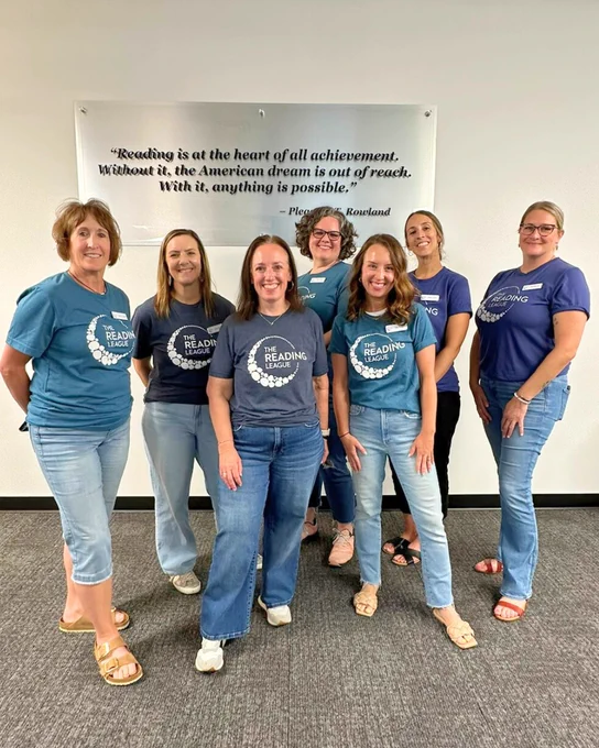 Seven PD specialists pose at The Reading League headquarters in Syracuse NY during a Summer 2025 Training.