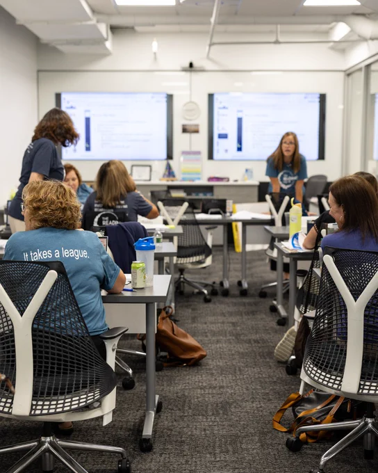 PD specialists gather and work in a classroom setting at a recent training at The Reading League headquarters in Syracuse, NY.