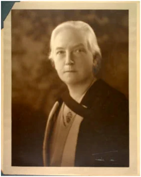 Black and white photo of Ethel Hurlbatt looking at the camera
