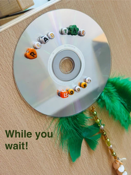Decorated CD ordering you to read the books. Some feathers make it look like a showgirl!
