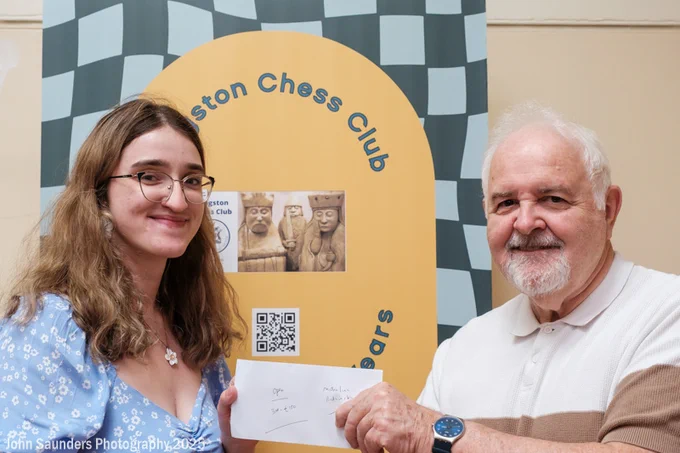 WGM Michalina Rudzinska (Poland) receives the prize for finishing 3rd in the 2025 Kingston Invitational Open from Kingston Chess Club president John Foley