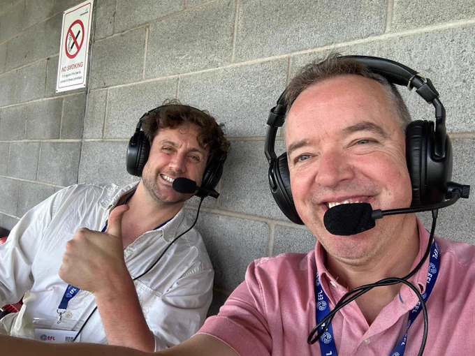 A picture of two Crawley town ADC Commentators wearing headsets and ready to commentate.