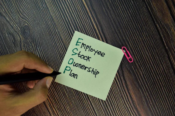 Sticky note reads employee stock ownership plan