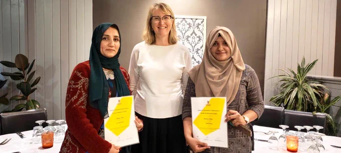 Samea Khan, Prof Lisa Keay and Rehana Khan displaying their award certificates.