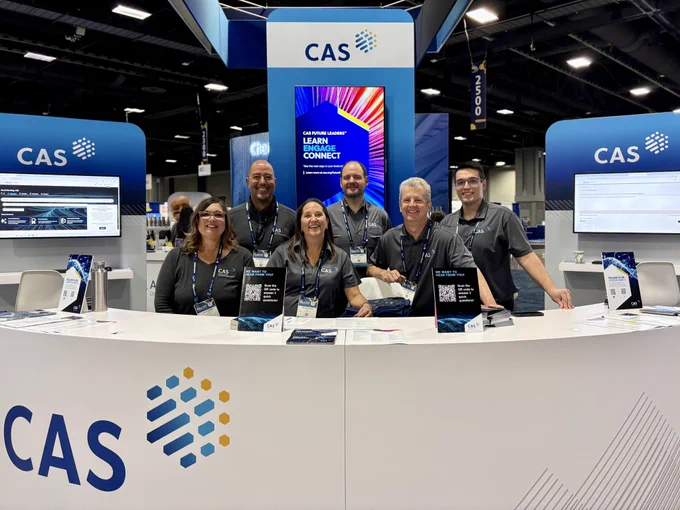 Six CAS staff members in the ACS Expo booth