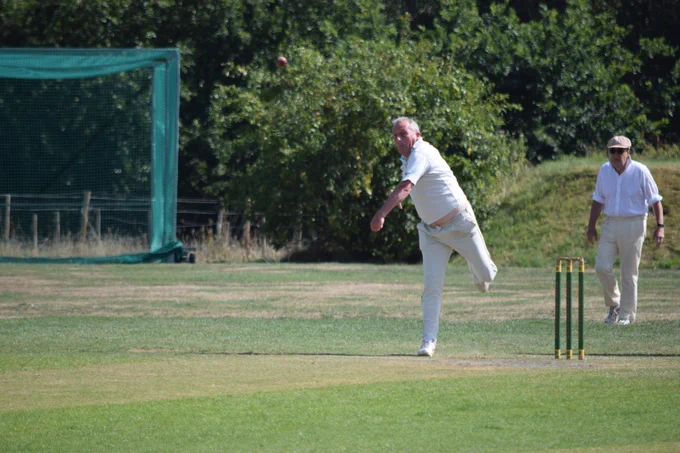 Lyndon pivots on right foot as he bowls