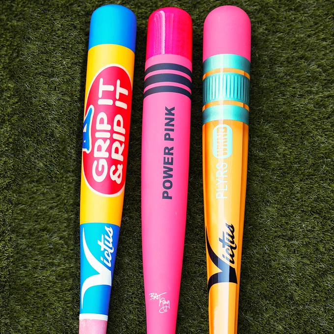 Three custom Victus bats: (left to right)
A bubble gum themed "grip it and rip it" bat
A Power Pink crayon bat
A PLYRS WKND pencil bat