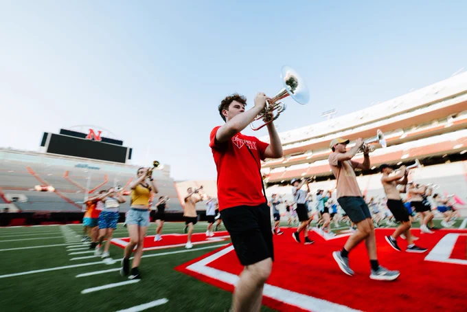 Eli Schuster, a senior mellophone player, marches during a warm-up exercise on August 18.