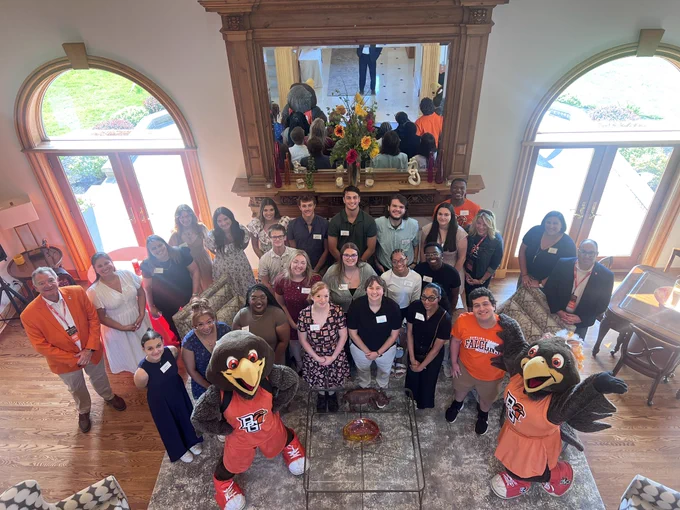 BGSU orientation leaders take a group photo with mascots and leadership