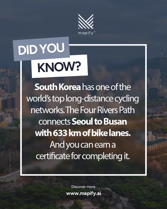 A darkened cityscape of Seoul, South Korea forms the background, with the Namsan Seoul Tower visible in the distance. Overlaid text reads: “Did you know? South Korea has one of the world’s top long-distance cycling networks. The Four Rivers Path connects Seoul to Busan with 633 km of bike lanes. And you can earn a certificate for completing it.” The Mapify logo appears at the top, and at the bottom the text says, “Discover more www.mapify.ai.”