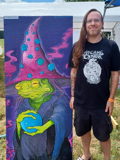     🔮“The Obsession Takes Hold”🔮
This piece embodies the internal struggle of obsession ~ the way it distorts perception, influences choices, and can consume the Self entirely.
A deranged, Murk-Bog frog, cloaked in dark robes and crowned with a strange, otherworldly hat. The rather large, wizardly hat represents both wisdom and burden, suggesting weariness under the weight of fixation & how addiction destabilizes the mind, flooding it with intensity while eroding clarity. It's grip around the glowing orb reveals how obsession can in turn take hold of the individual. The orb itself is bright, alluring, and impossible to ignore: a symbol for the substance, thought, or compulsion that consumes attention and energy.
Obsession itself has a kind of spell-like power.. one that can entrap, but also be studied, understood, and eventually overcome. Recovery begins with recognizing the enchantment for what it is: not truth, not self, but an external hold that can be released.