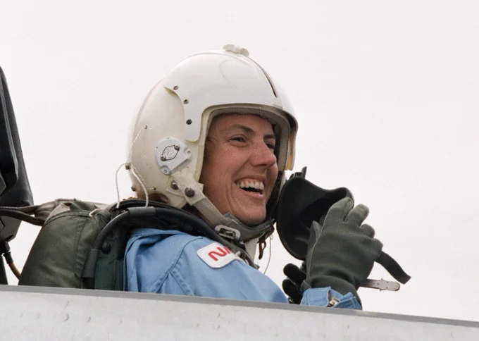 Sharon Christa McAuliffe, the Teacher in Space participant from Concord, New Hampshire, prepares for a ride in the rear station of one of NASA's T-38 jet trainers at Ellington Field near Johnson Space Center. Date Created: October 3, 1985. Credit: NASA