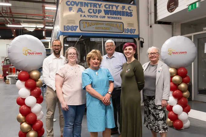 Tom Quay, Laura Creaven, Joan Aitken, Jeff Anderson, Charlie Barnes and Jennie Martin stand in front of the Coventry FC FA Cup Winners Bus at the Coventry Transport Museum