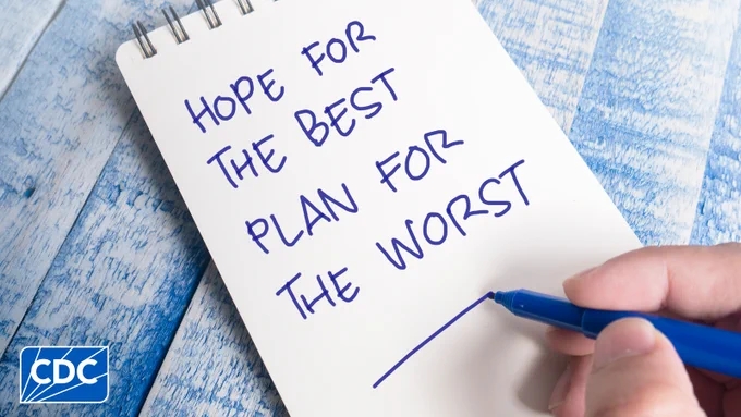 Person writing on white notepad with text that reads “Hope For The Best Plan For The Worst.” 
