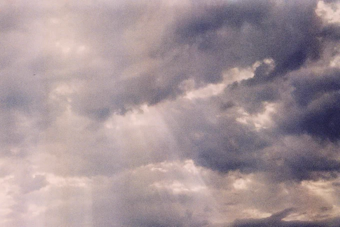 Dark clouds with "god rays" shining through.