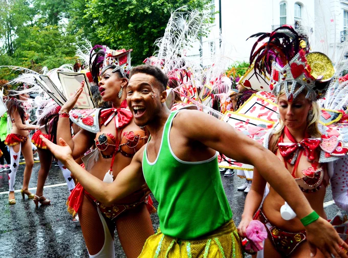 Carnival reveller partying with dancers. Pic by David Sedlecký