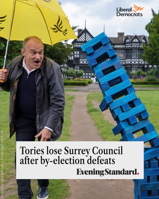 Photo of Ed Davey knocking over a blue jenga tower. Headline from the Evening Standard "Tories lose Surrey Council after by-election defeats"