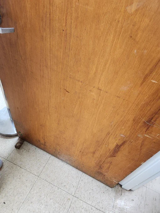 door scuffs show why you need a kick plate or armor plate from Deck the Door Decor