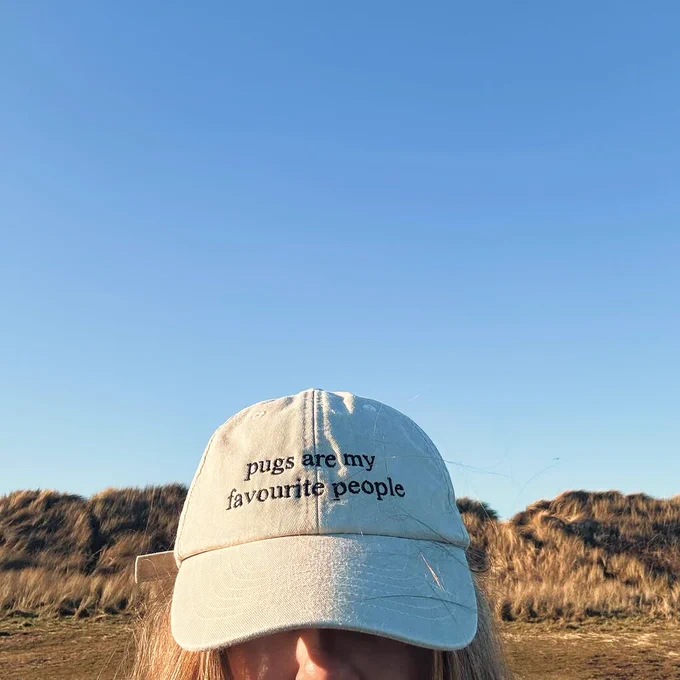 Simone Magill's cap reads: "Pugs are my favourite people."