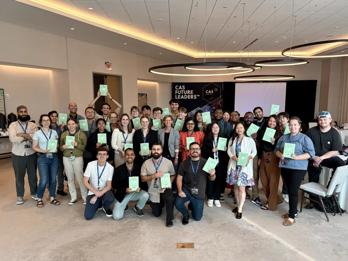 A group of early-career scientists gathered around one of the session speakers, Jennifer Heemstra