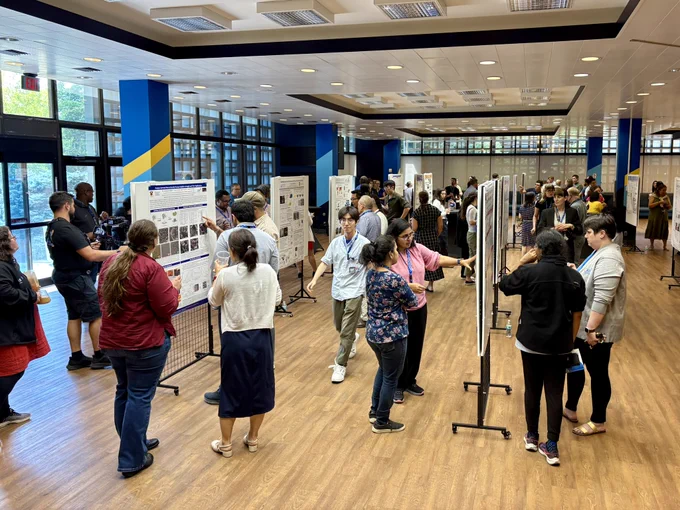 CAS Future Leaders and CAS staff attending a poster session