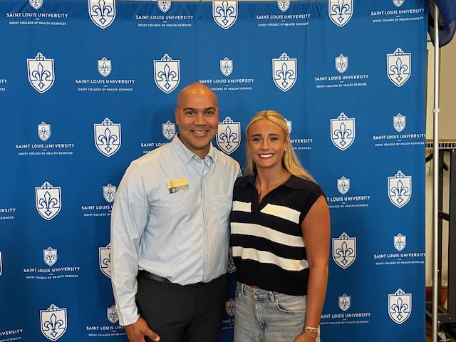 Dean Rousseau pictured with Emily Thompson, student in the Health Sciences program on the Physician Assistant track, during the Doisy College of Health Sciences 2025 New Student Orientation on August 18, 2025 on the campus of Saint Louis University