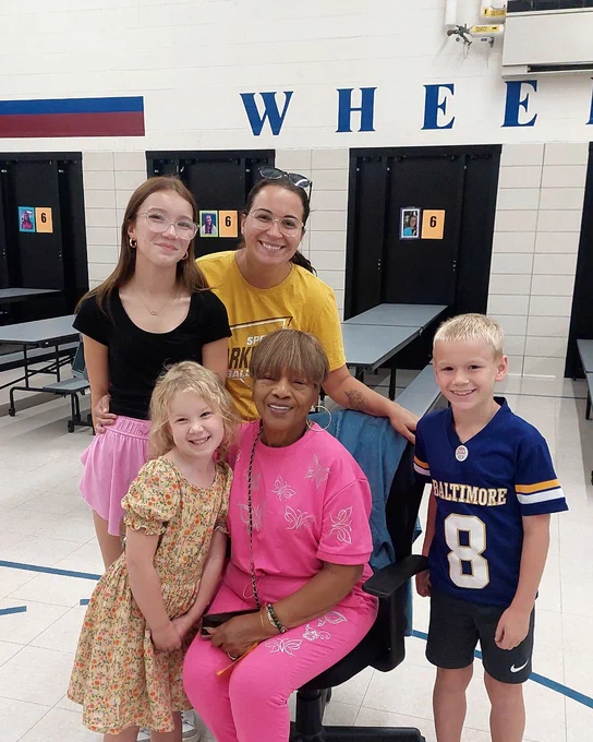 Ms. Alice from AYS at Wheeler Elementary visiting with former after-school students