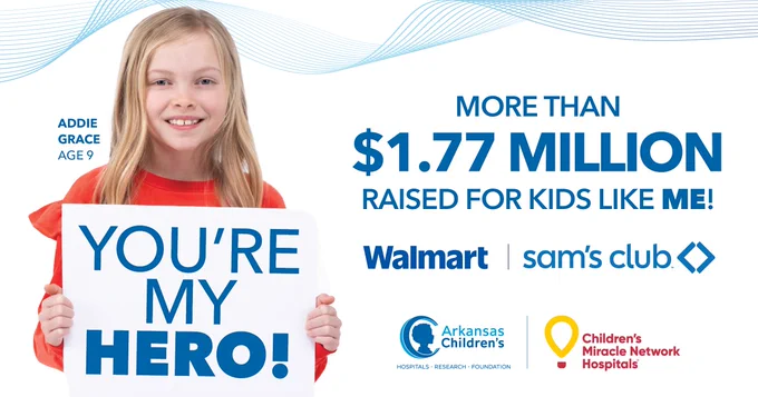 Addie Grace, age 9, holding a sign saying 'YOU'RE MY HERO!' with information about more than $1.77 million raised for kids by Walmart, Sam's Club, and Arkansas Children's through Children's Miracle Network Hospitals.