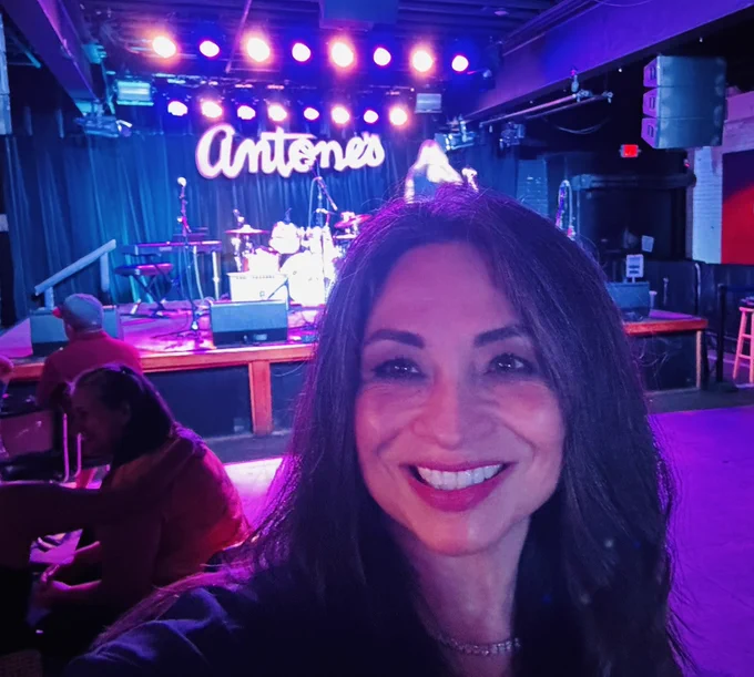 Diana taking a selfie in front of Antone’s stage