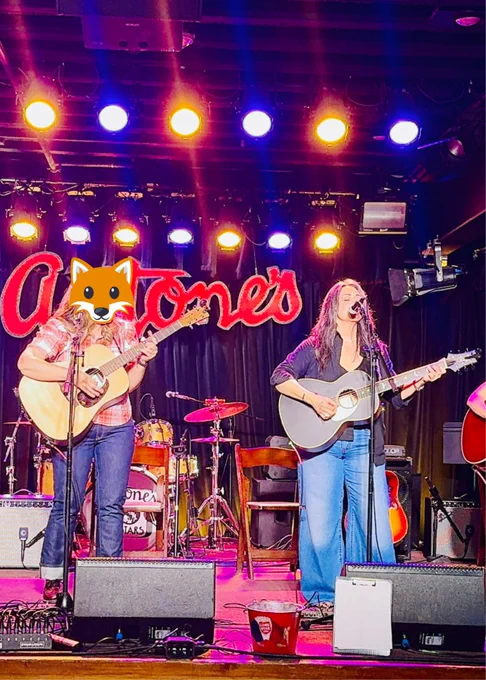 Diana on stage at Antone’s playing guitar