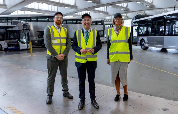 DAERA Minister Andrew Muir pictured with Wrightbus Environmental, Social and Governance (ESG) Director Sarah Schafer and Dr. Andy Harris, Head of Research and Data Analytics at Wrightbus during a tour of the Ballymena facility, showcasing the company’s hydrogen and battery-electric bus production lines