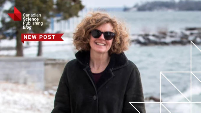 Dr. Shelley Arnott wearing a black coat standing near a snowy waterfront with trees and rocks in the background. Social card for Canadian Science Publishing blog post.