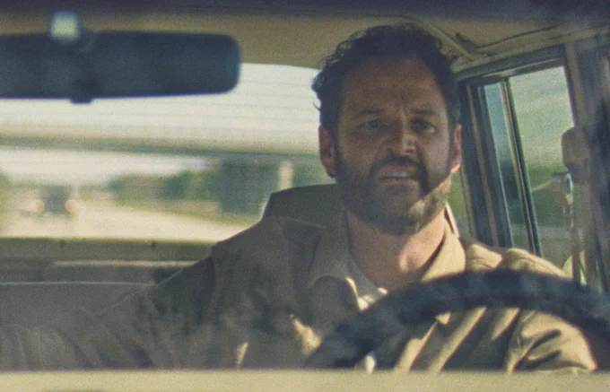 Pacific Northwest actor and writer Kyle Marvin looking quite nervous while driving a car in a still from his new romantic comedy SPLITSVILLE. 