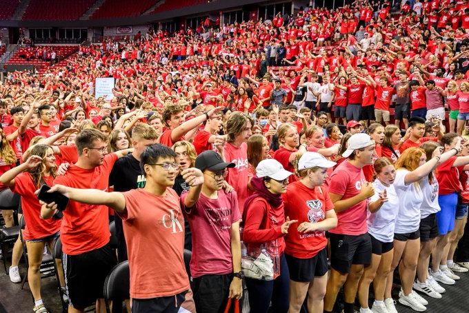 Students sway together to “Varsity” during the Chancellor's Convocation.