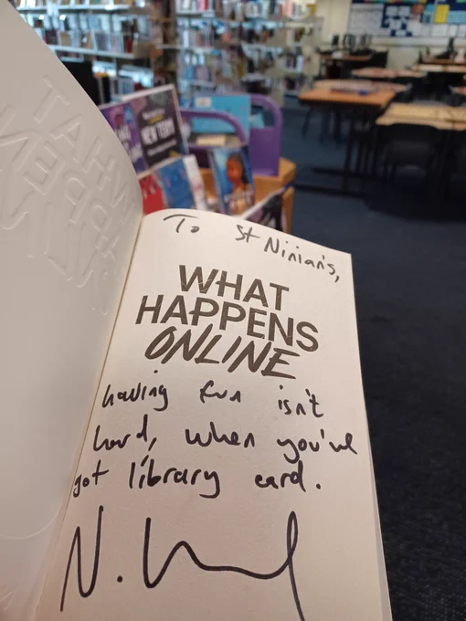 Signed book from Nathaneal Lessore reads "Having fun isn't hard, when you've got a library card."