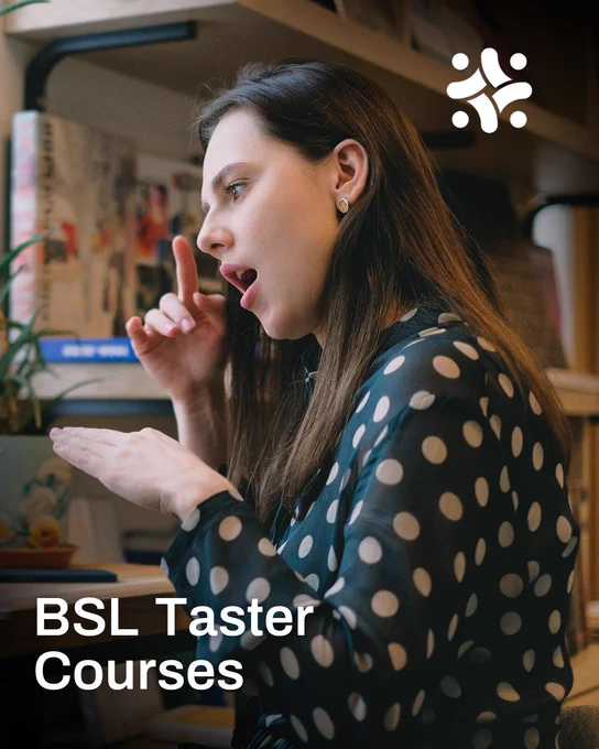 A young woman using sign language to communicate via a laptop screen.