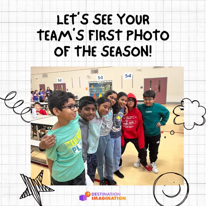 Image of a DI team posing together for a photo in their school cafeteria.