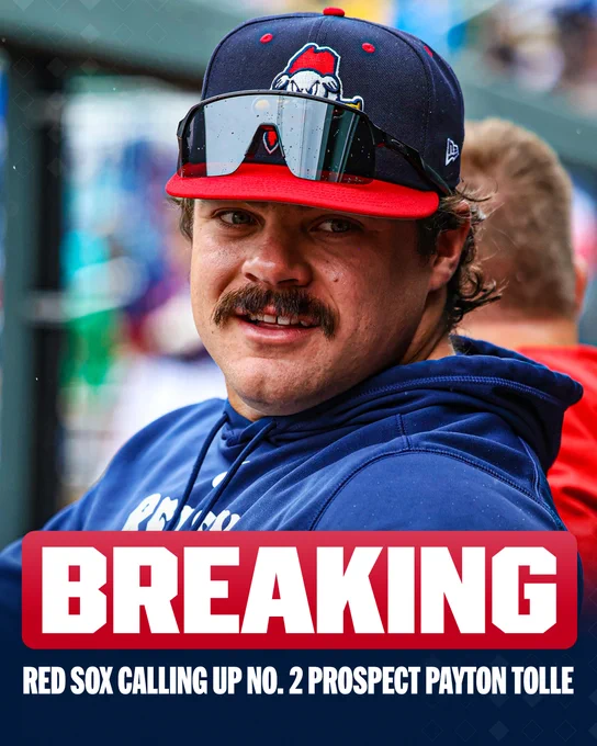 BREAKING: Red Sox calling up No. 2 prospect Payton Tolle
Payton Tolle in the dugout wearing dark blue Sea Dogs apparel.