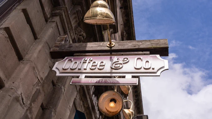Coffee & Co sign above door.