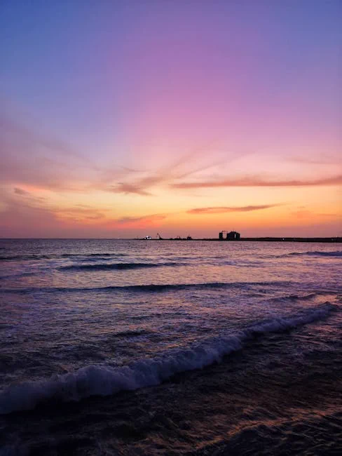 Vivid sunset scene at Colombo beach with vibrant skies and gentle waves for a tranquil seaside view.