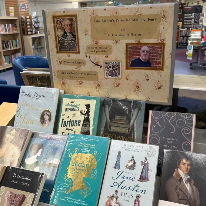 A display at Farnham Library advertising an event with Dr Christopher Herbert.