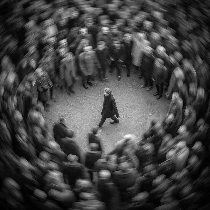 A man walks through a crowd of people walking in circles, no one knowing where they are going, but the man moves with confidence on his now moral path anyway.