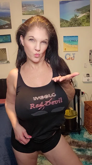 Former Pro figure skater,Adult actress,Sex Educator & Podcaster Coralyn Jewel modeling an Imbolg Red Devil Logo tank top